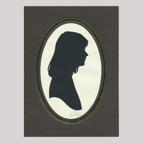 
        Front of silhouette, with woman in frame looking right.